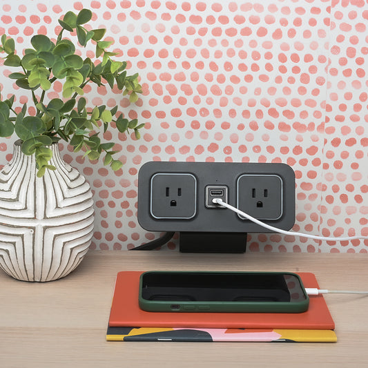 CubieDash hotel charging hub on a bracket with power outlets and usb ports