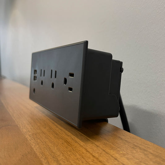 CubieDash hotel charging hub on a bracket with power outlets and usb ports