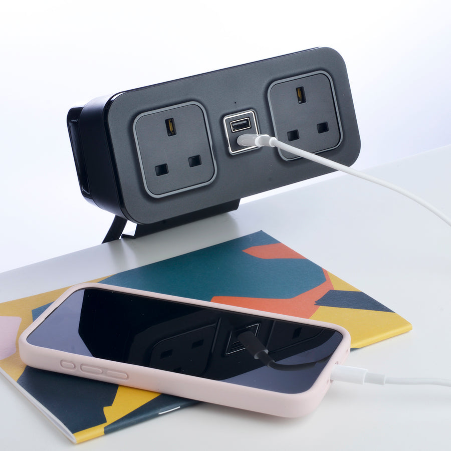 CubieDash hotel charging hub on a bracket with power outlets and usb ports